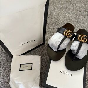 Gucci Black Leather Flip Flops with Gold Logo